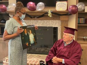 Proveer at Northgate | Senior man in graduation cap and gown reliving his ceremony